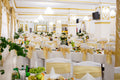 Beautifully organised gala event with glasses on white-draped tables