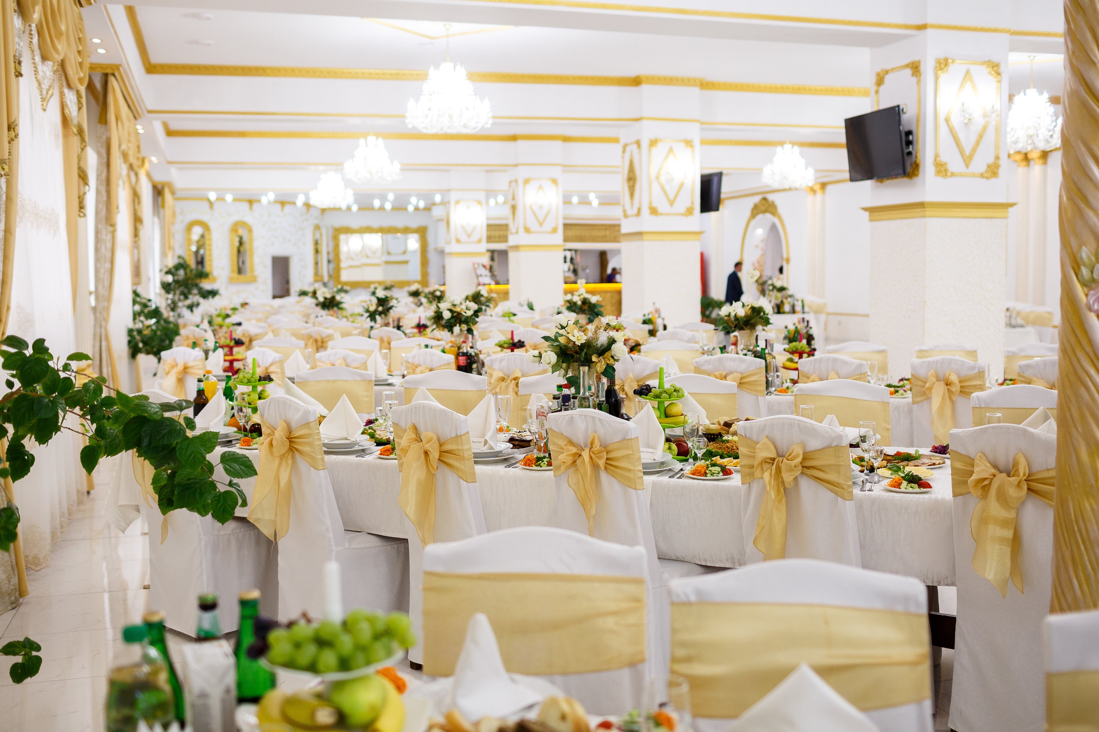Beautifully organised gala event with glasses on white-draped tables